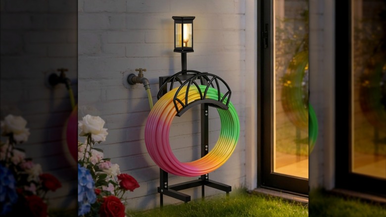 HZE Hose Holder with Solar Light next to house at night