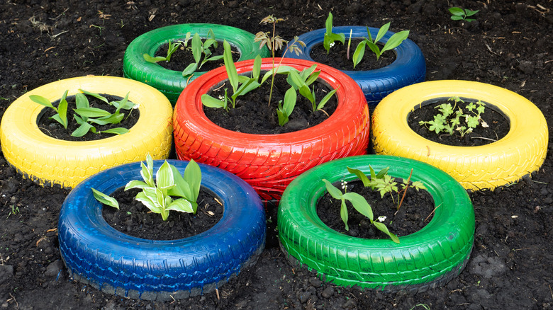 Multicolored car tires used for flower beds