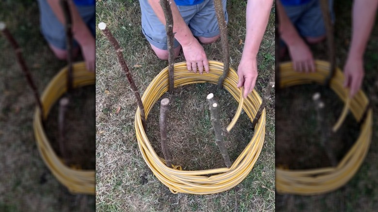 Demonstrator adjusting the water hose