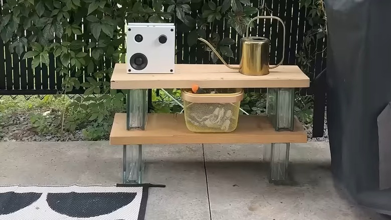 Wooden garden bench made from wooden beams and glass blocks