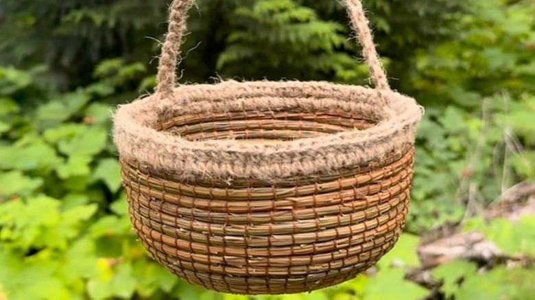 A DIY foraging basket made using pine needles and jute twine crochet.