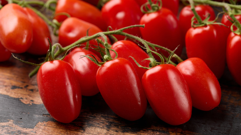 a cluster of San Marzano tomatoes on a table