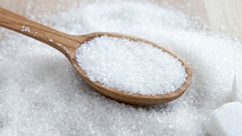 Wooden spoon with sugar