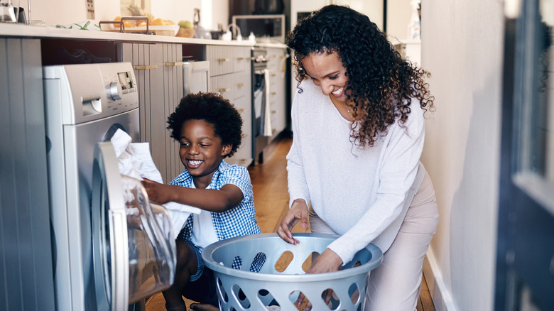 happy family doing laundry together