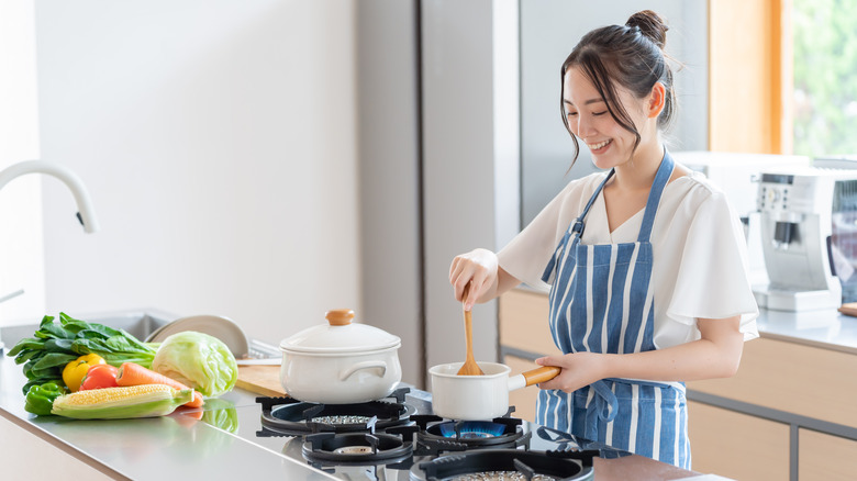 woman cooking at stove