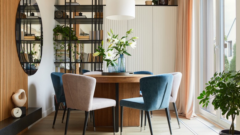 dining room with large mirror 