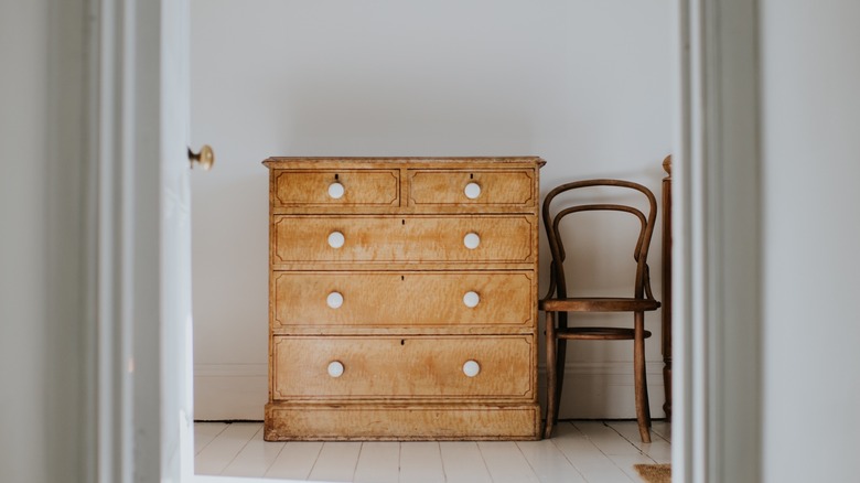 wood dresser in simple bedroom