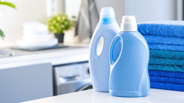 laundry detergent bottles and towels