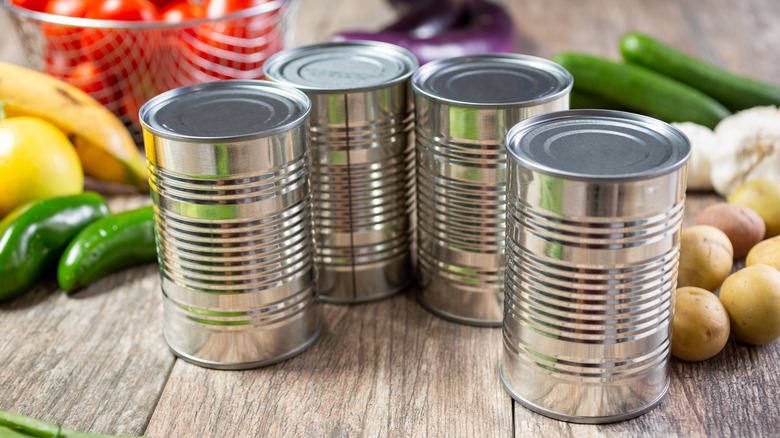 four tin food cans