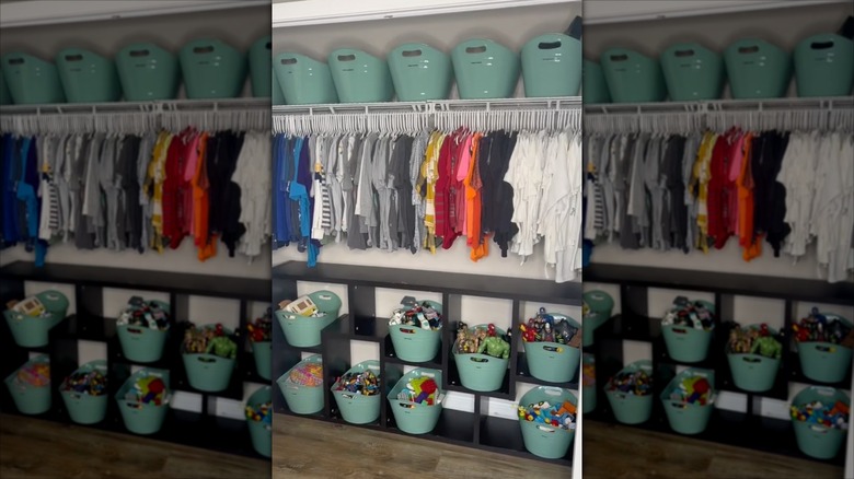teal toy storage bins on shelf