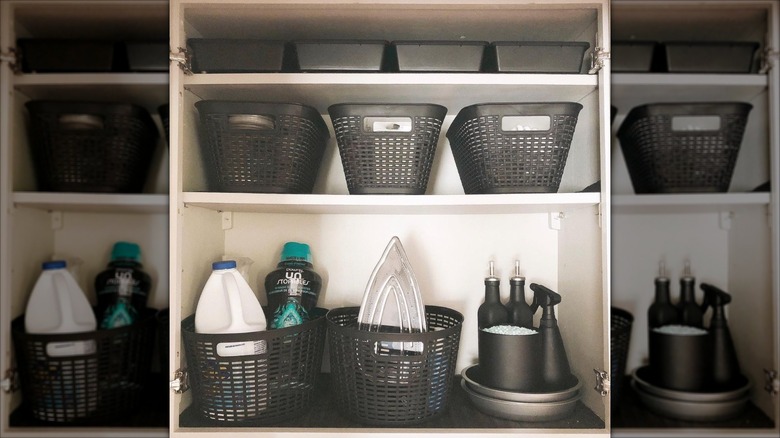 gray storage bins in laundry room