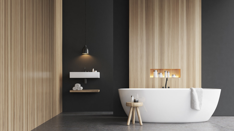 dark bathroom with gold touches 