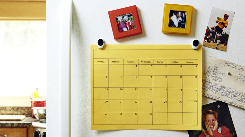 Calendar on the front of a fridge