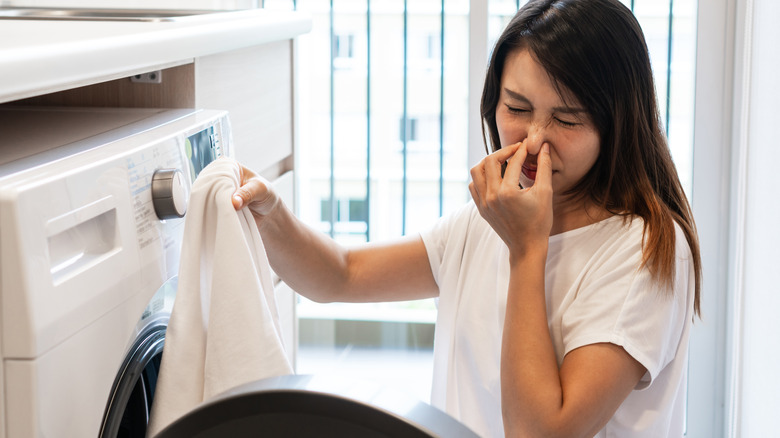 Person irritated by smelly laundry