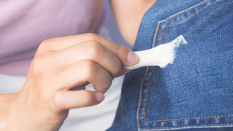 Sticky gum stuck to a pair of jeans.