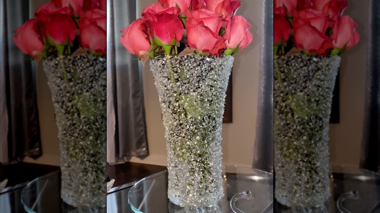 A crushed glass vase DIY with pink roses inside