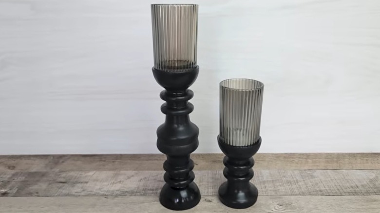 Two Dollar Tree pillar candle holders of different heights
