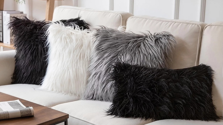 fuzzy throw pillows on couch