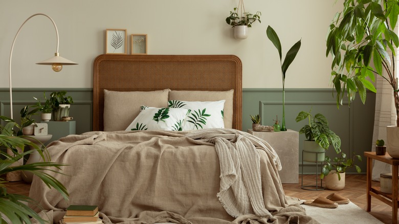 a quietly elegant bedroom with shades of beige and green