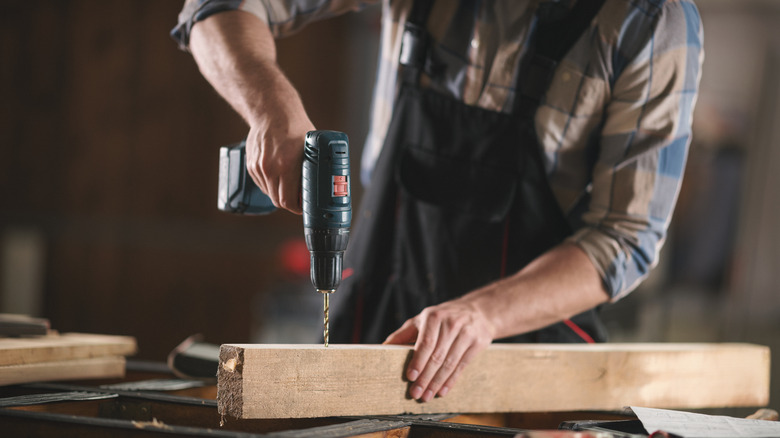 man using a cordless drill