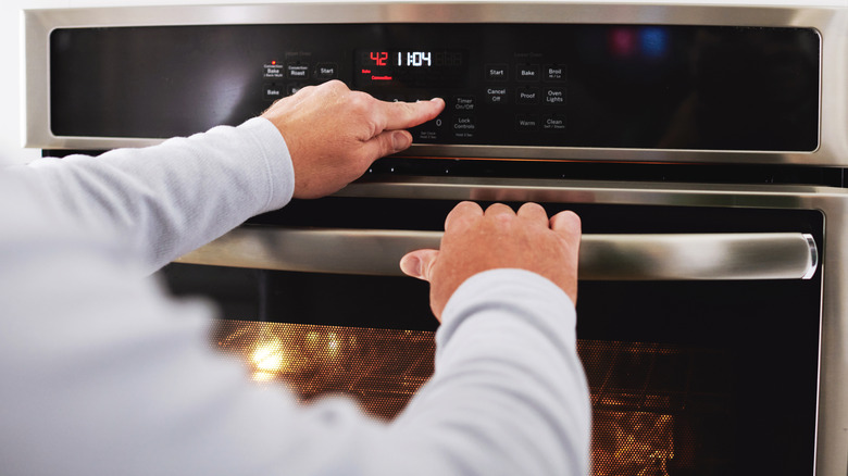 Person using oven