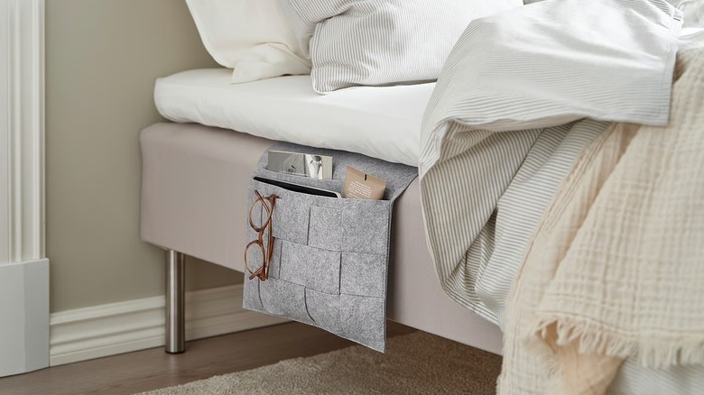 IKEA SILÄNG storage pocket attached to the side of an unmade bed