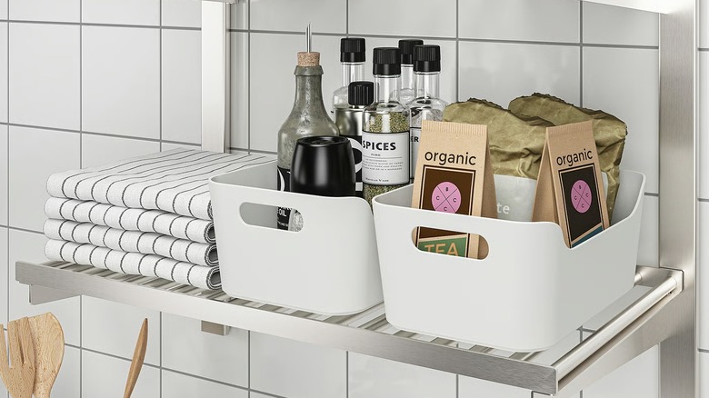 spices and pantry items in IKEA UPPDATERA storage baskets on a shelf
