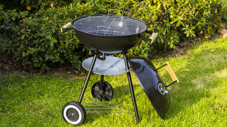 Men cooking on gas grill