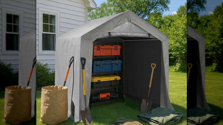Fabric carport tent with lawn supplies inside.