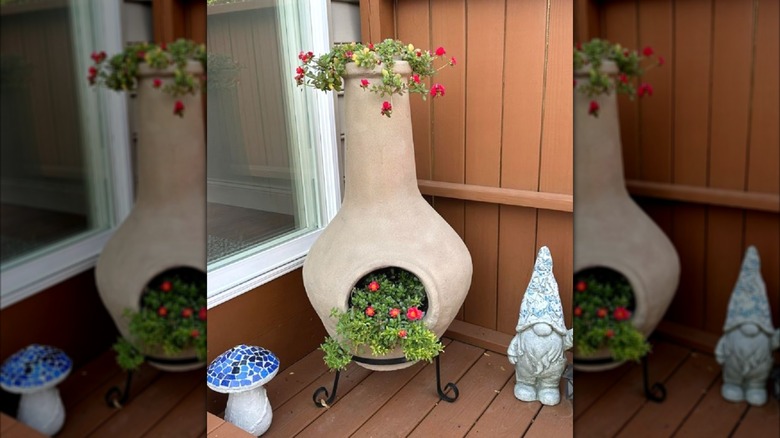 Chiminea turned into a planter with flowers