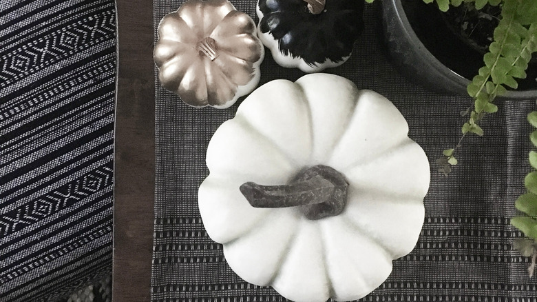 Faux pumpkins sitting on a table