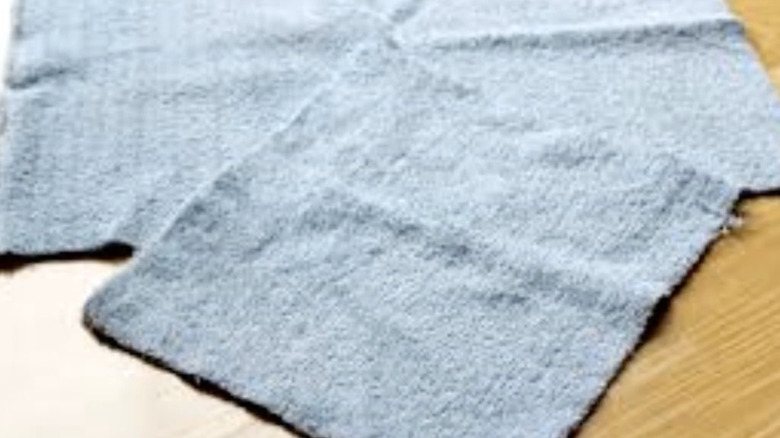 Old towel cut into a bathroom cleaning rag.