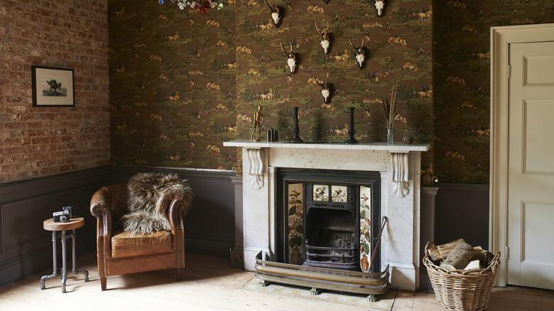 A dark eclectic living room with a fireplace