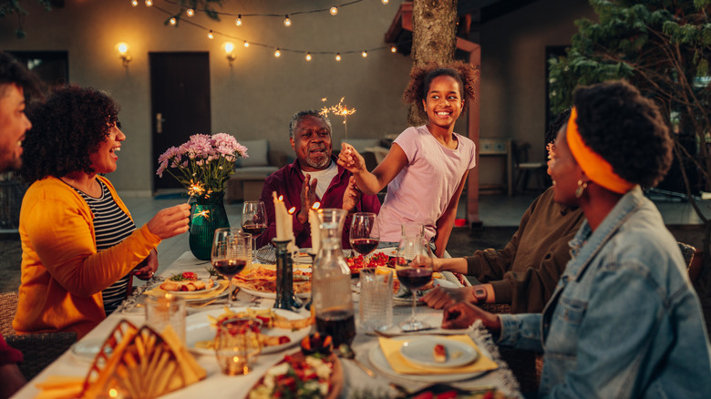 Family celebrating in backyard