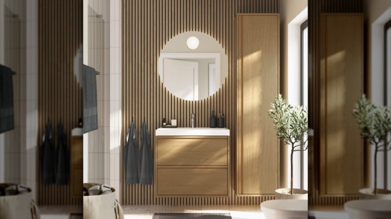 A stylish, brightly lit contemporary bathroom with wood accents