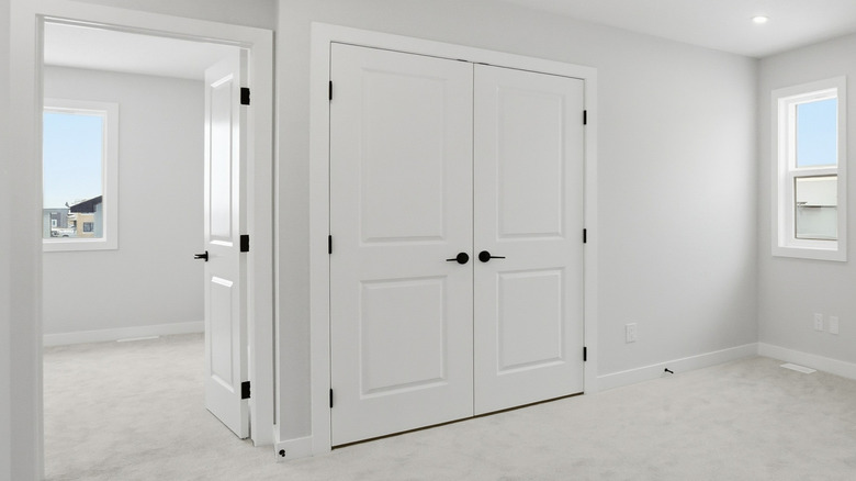 Standard white doors fitted to a room and closet