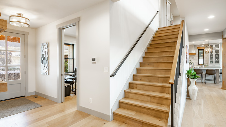 Entryway to a home with neutral walls and doorways