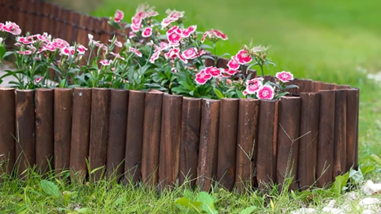 Worth's wooden short fence edging being used for a border as well as driveways