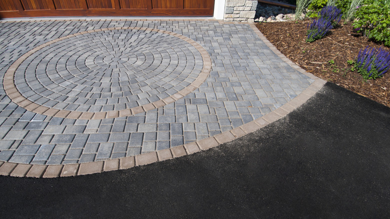 wide brick and asphalt driveway