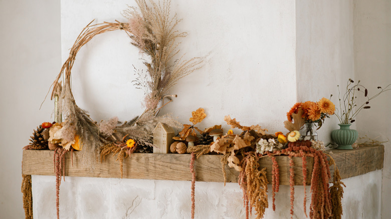 A fall themed mantel with natural decor pieces