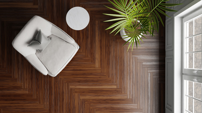 An overhead view of wooden herringbone flooring
