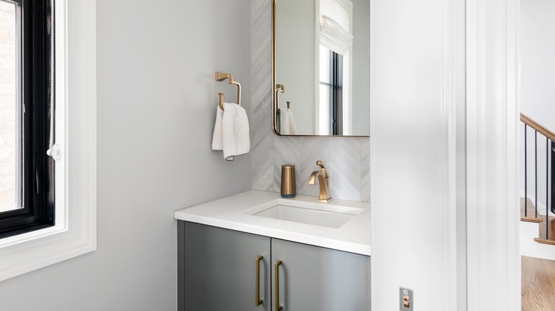 bathroom with brass pulls