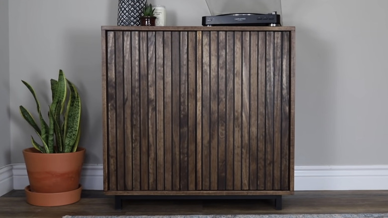 The finished mid-century modern DIY slat wood storage cabinet