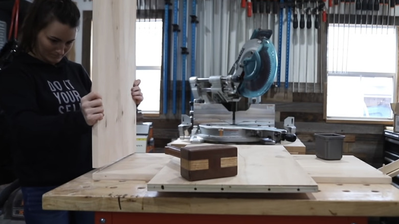 The slat wood cabinet carcass being assembled using dowel joints