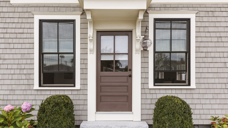 Gray house with brown door