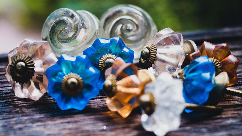 A grouping of glass drawer pulls