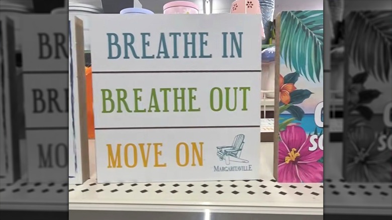 the Breathe Word Block Decor features the name of one of Jimmy Buffett's popular songs