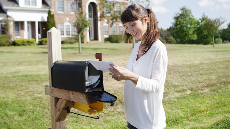 woman checking mailbox 