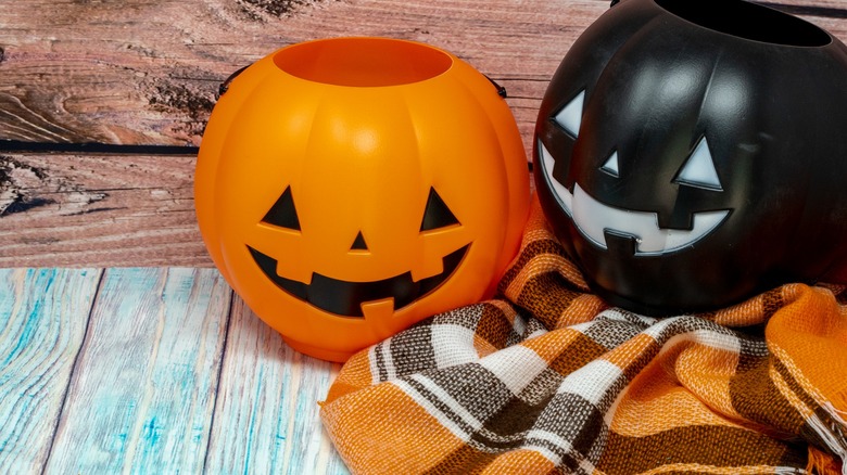 two plastic pumpkins on porch