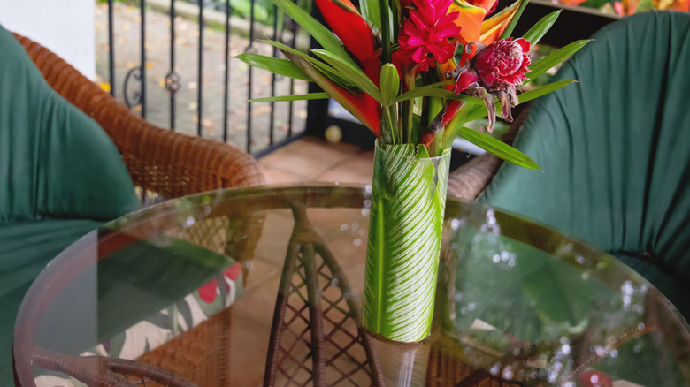 Bouquet of flowers on a glass patio table